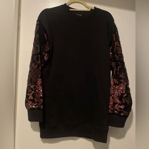 NWOT:
TOPSHOP Black Crew Neck Sequin Faux Fur Sweater
Topshop